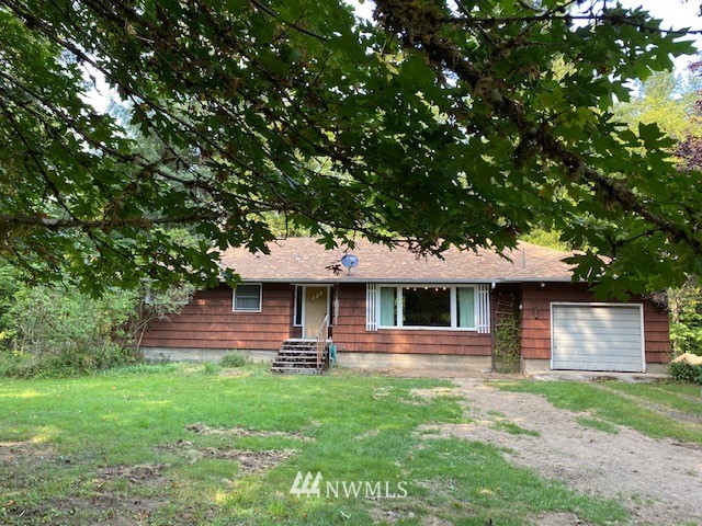 230 Frank Smith Road Toutle, WA 98649 - Photo 1 of 19 a front view of a house with a yard