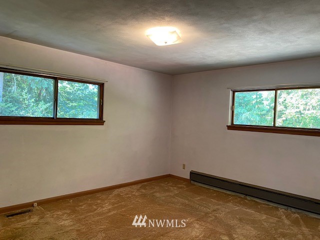 230 Frank Smith Road Toutle, WA 98649 - Photo 14 of 19 an empty room with a window