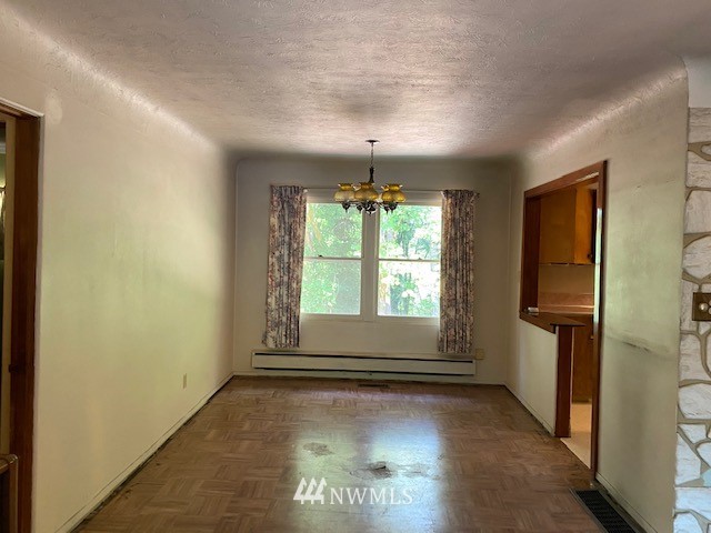 230 Frank Smith Road Toutle, WA 98649 - Photo 7 of 19 an empty room with windows and garage