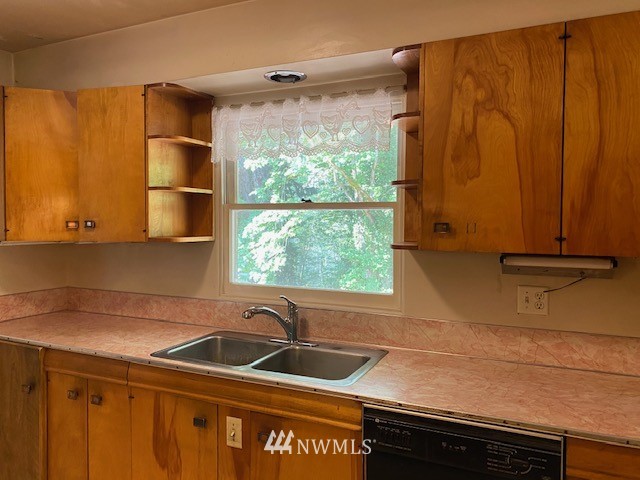 230 Frank Smith Road Toutle, WA 98649 - Photo 10 of 19 a kitchen with a sink and a large window