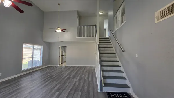 a view of an entryway with wooden floor