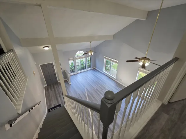 a view of an entryway wooden floor and stairs