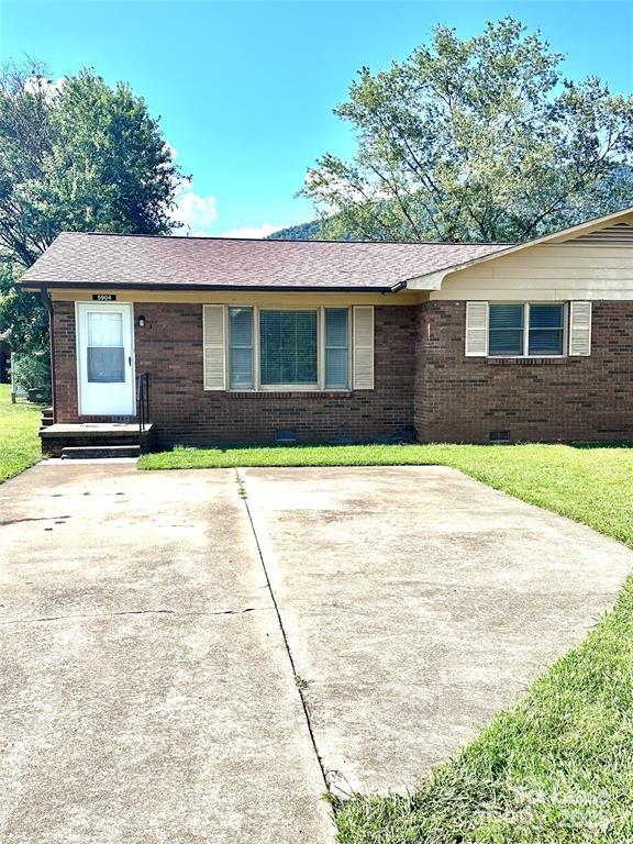 5904 Highway 70 Old Fort, NC 28762 - Photo 11 of 11 a front view of a house with a yard and garage