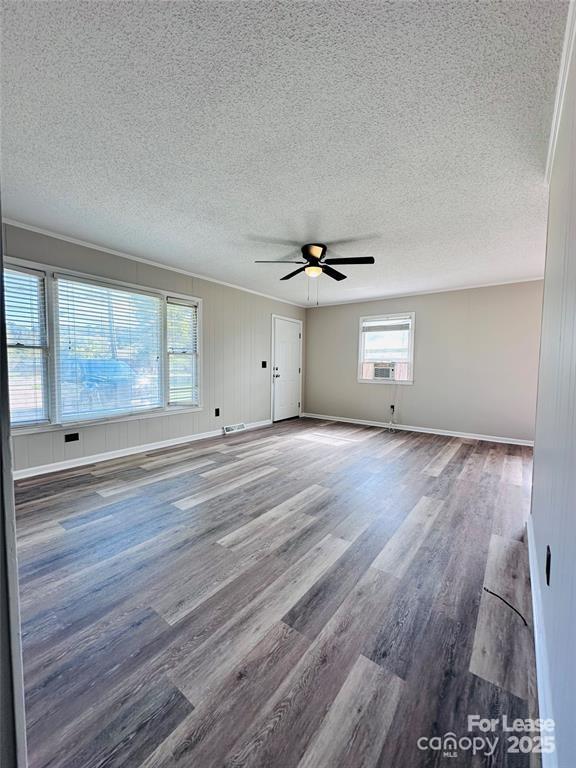 5904 Highway 70 Old Fort, NC 28762 - Photo 2 of 11 a view of an empty room with wooden floor and a window