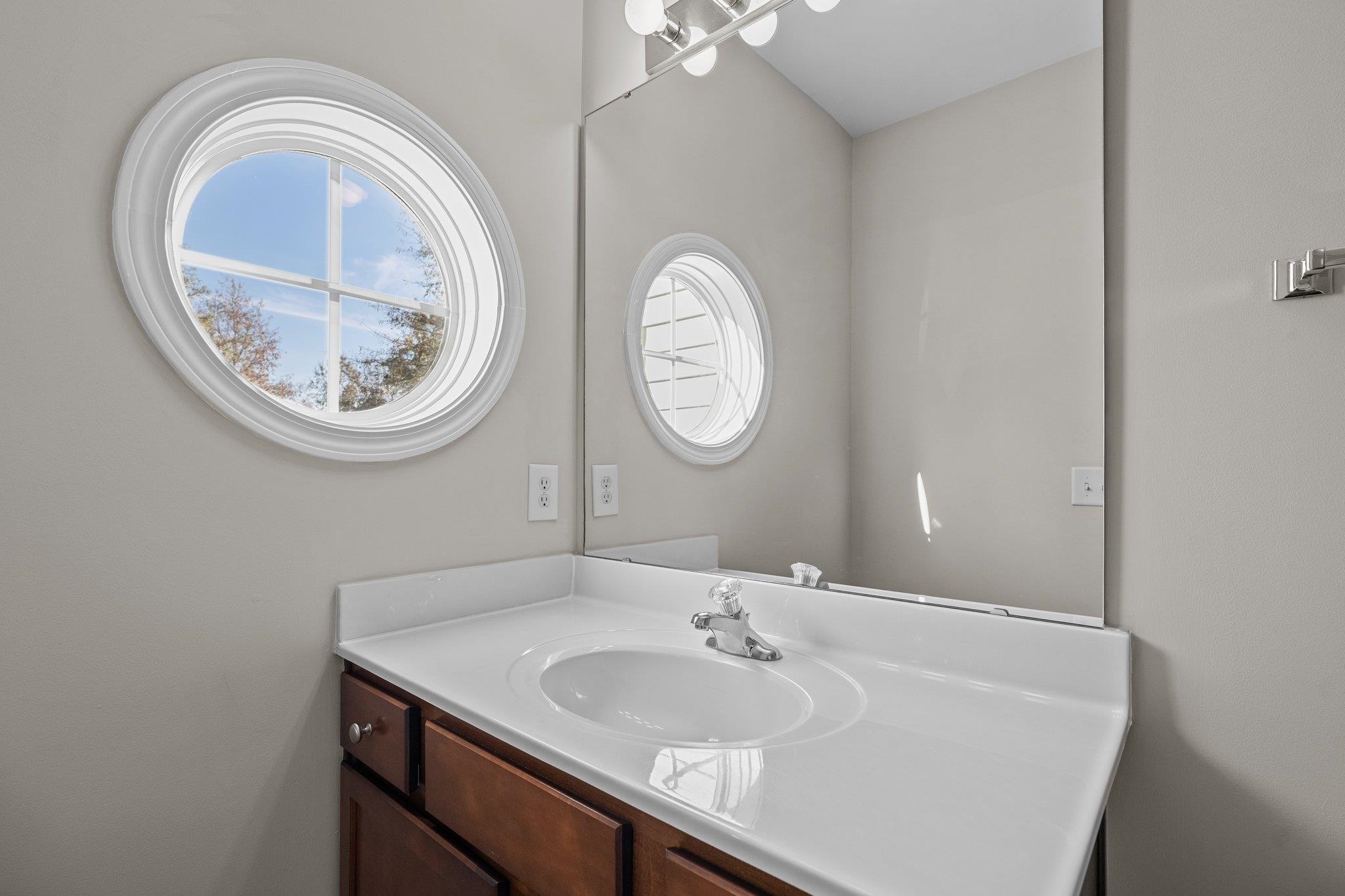 6705 Morgantown Street Raleigh, NC 27616 - Photo 18 of 40 a bathroom with a sink and a mirror