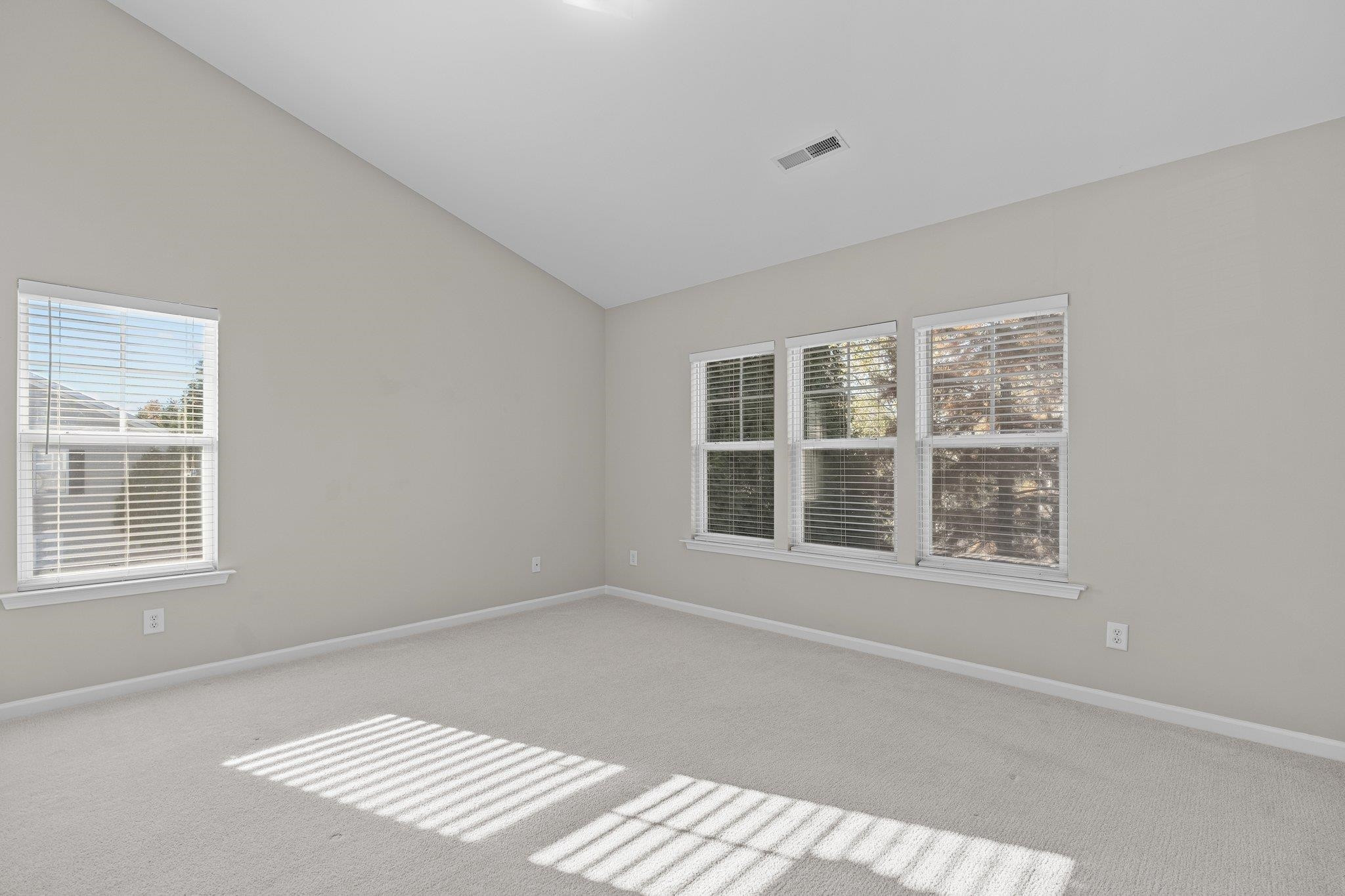 6705 Morgantown Street Raleigh, NC 27616 - Photo 21 of 40 a view of an empty room with a window