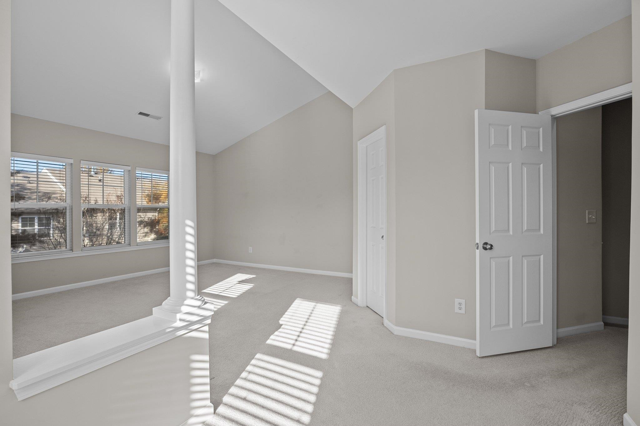 6705 Morgantown Street Raleigh, NC 27616 - Photo 26 of 40 a view of a bedroom with wooden floor and windows