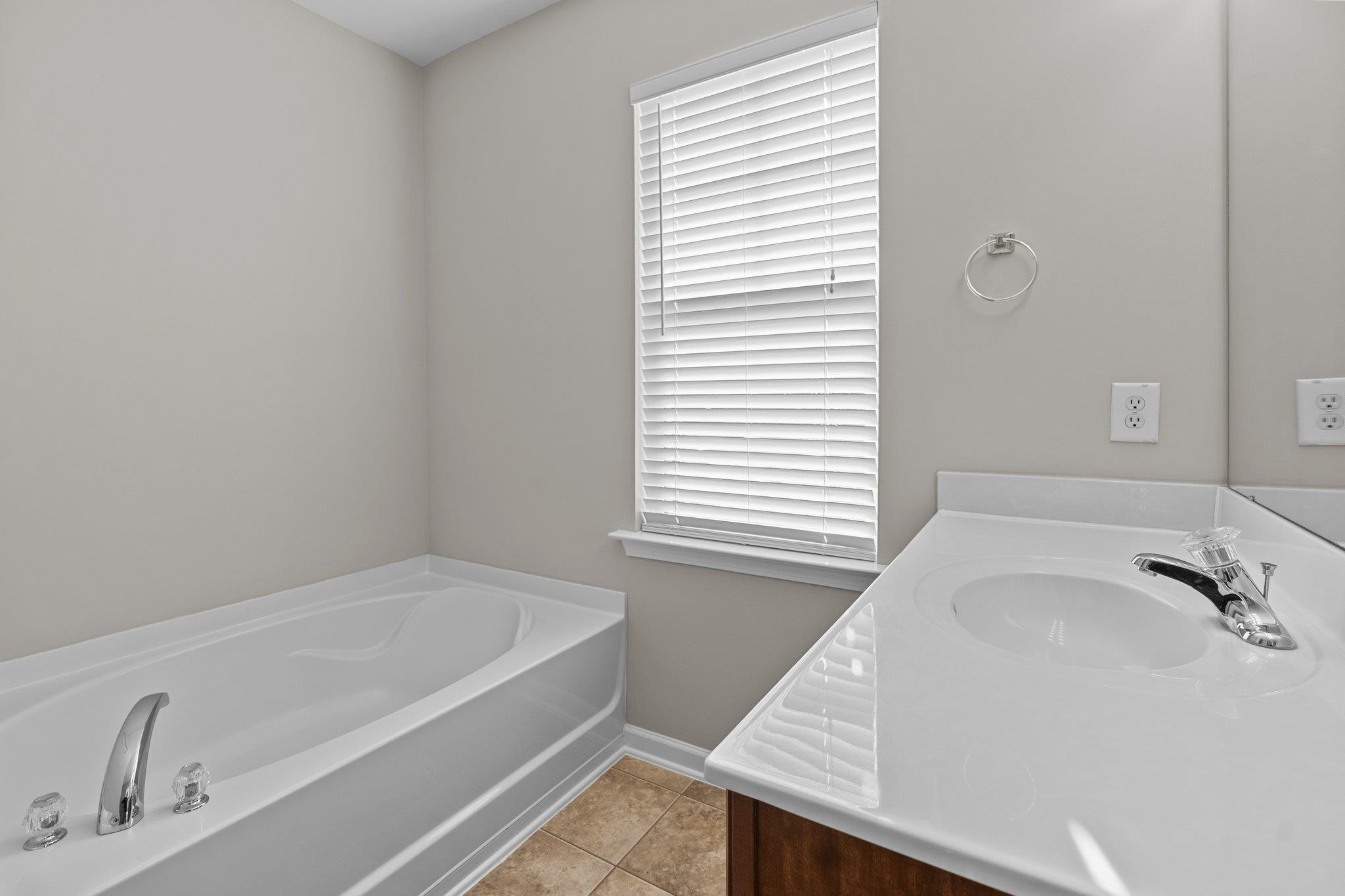 6705 Morgantown Street Raleigh, NC 27616 - Photo 30 of 40 a bathroom with a tub and a sink