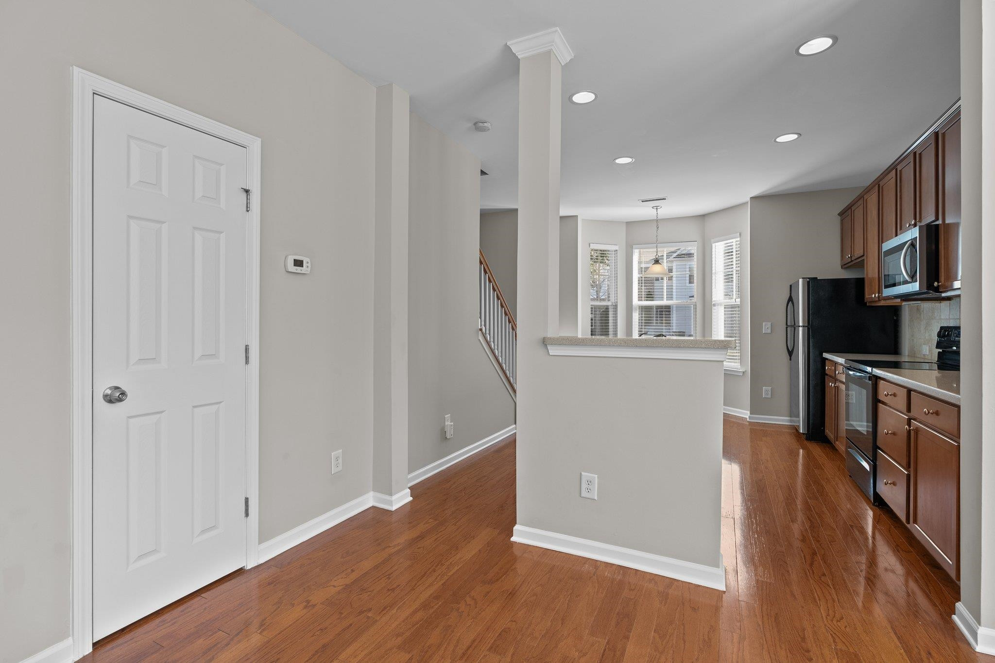 6705 Morgantown Street Raleigh, NC 27616 - Photo 3 of 40 wooden floor in an empty room with a window and wooden floor