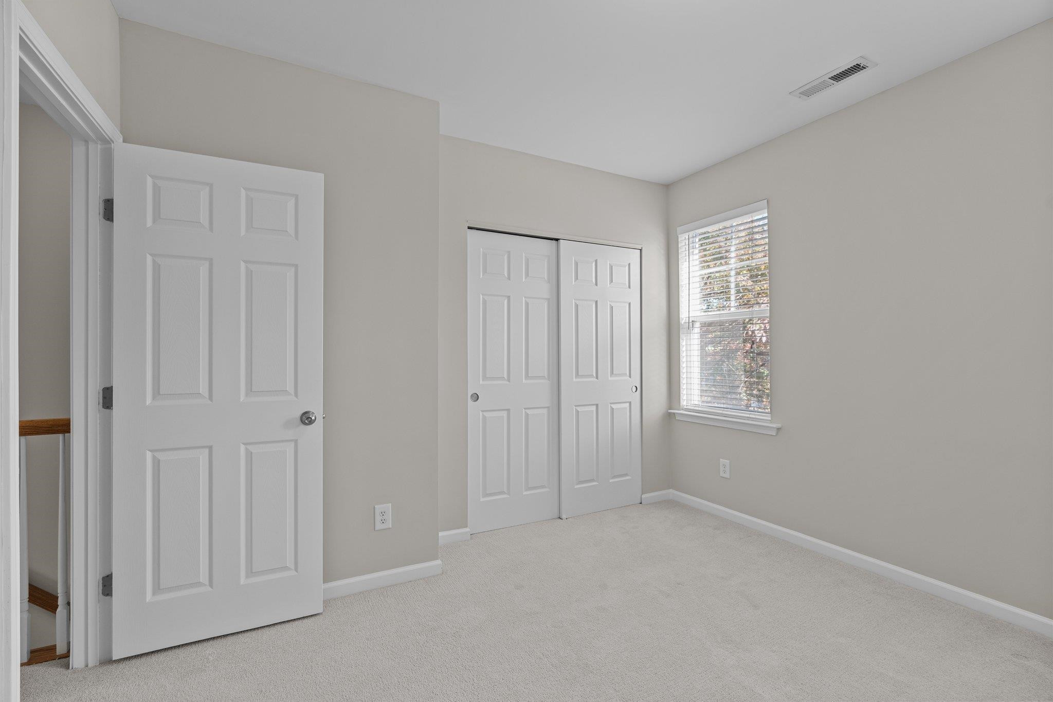 6705 Morgantown Street Raleigh, NC 27616 - Photo 33 of 40 an empty room with windows and closet