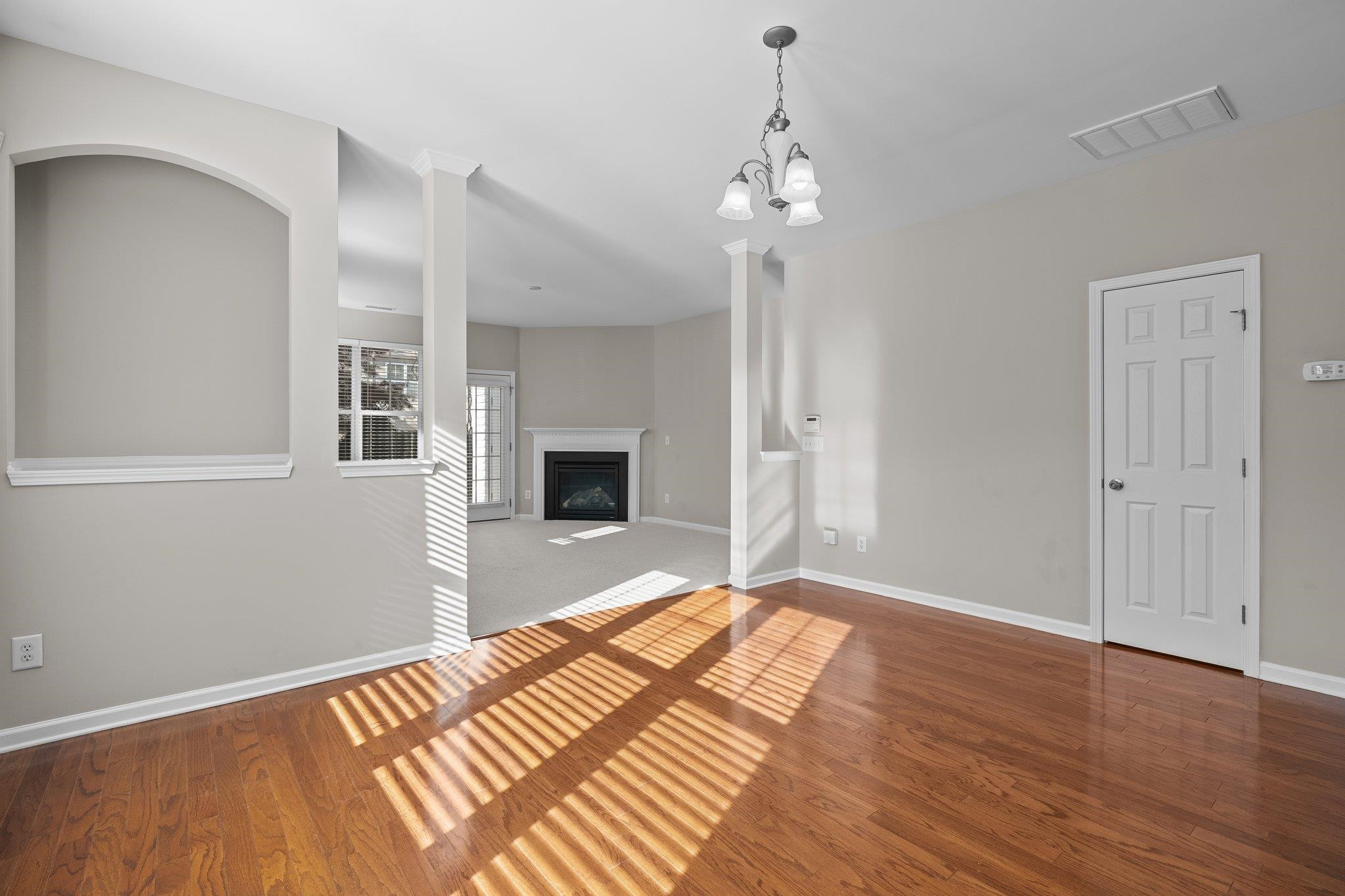6705 Morgantown Street Raleigh, NC 27616 - Photo 4 of 40 a bedroom with a bed and a chandelier fan
