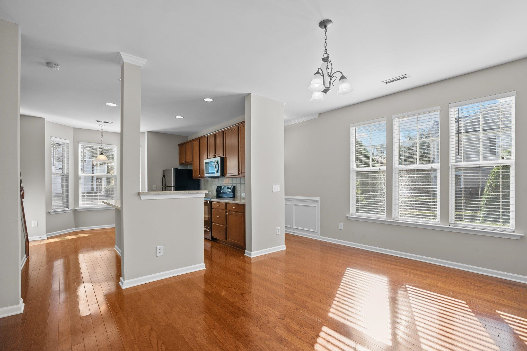 6705 Morgantown Street Raleigh, NC 27616 - Photo 5 of 40 a view of livingroom with furniture wooden floor and windows