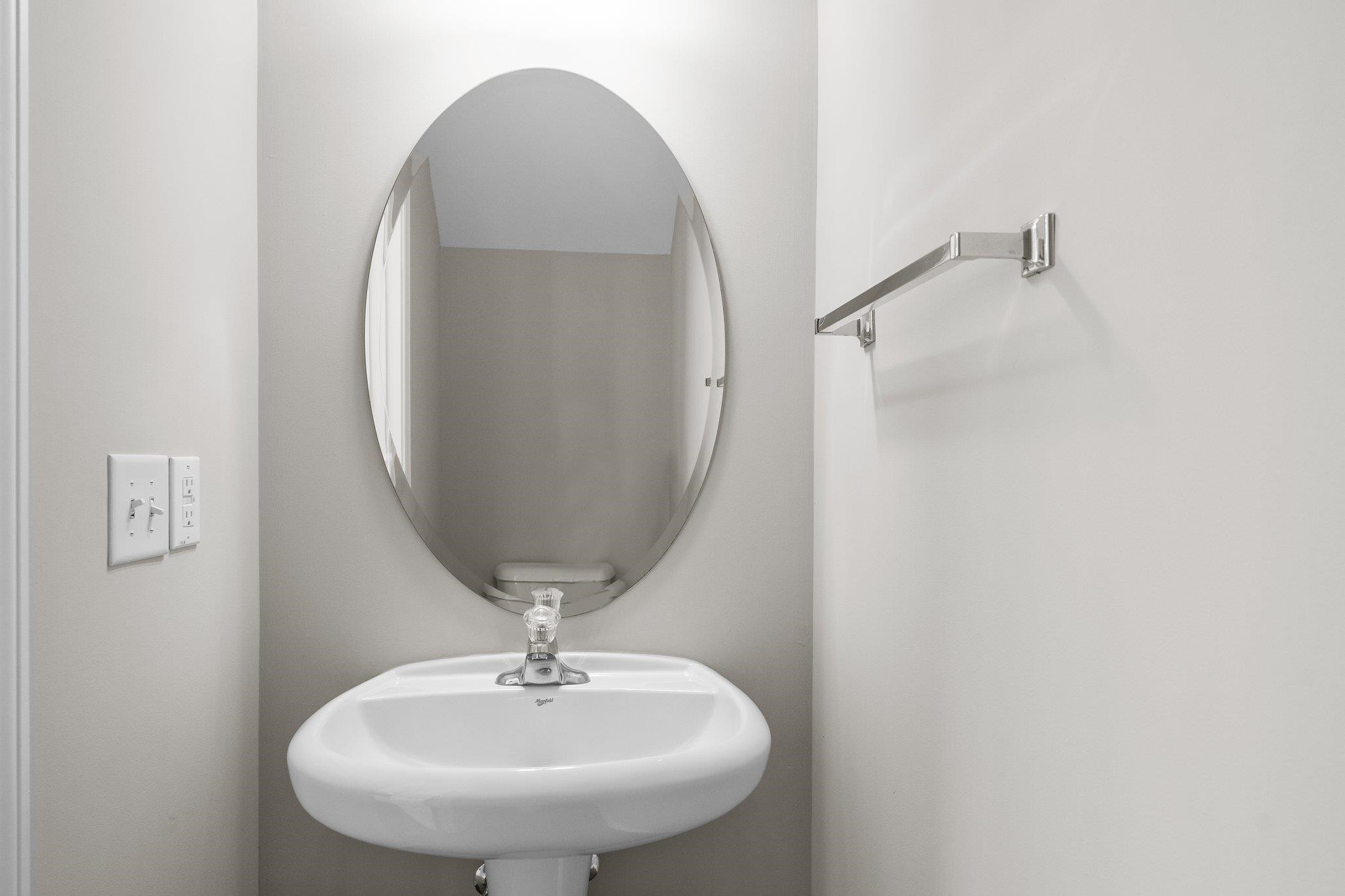 6705 Morgantown Street Raleigh, NC 27616 - Photo 8 of 40 a bathroom with a sink and mirror