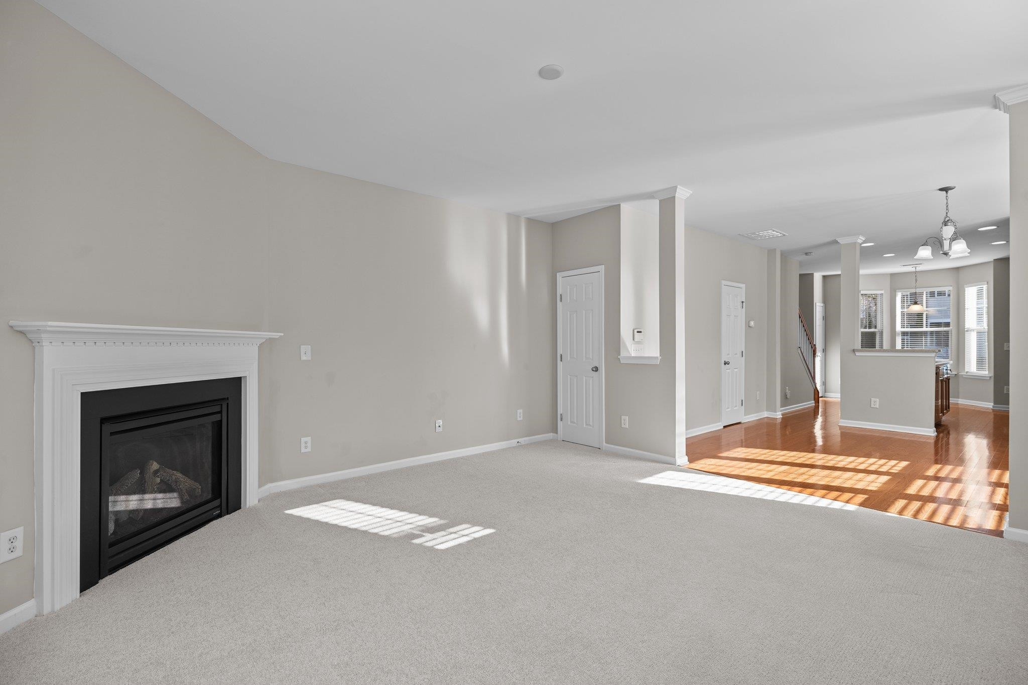 6705 Morgantown Street Raleigh, NC 27616 - Photo 9 of 40 a view of an empty room with a fireplace