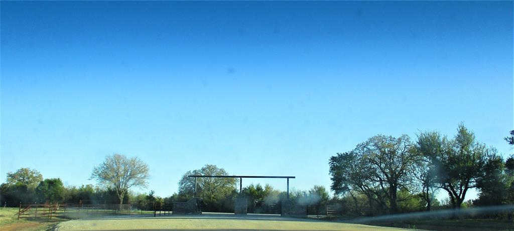144 River Cyn Road Palo Pinto, TX 76484 - Photo 9 of 9 a view of grassy field with trees in the background