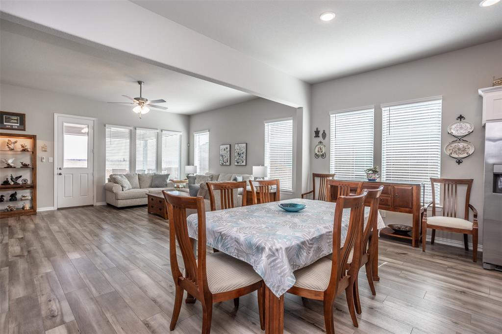 622 Juneau Street Gainesville, TX 76240 - Photo 24 of 39 a view of a dining room with furniture and wooden floor