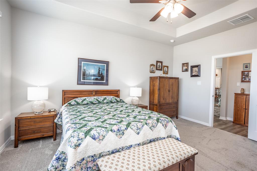 622 Juneau Street Gainesville, TX 76240 - Photo 27 of 39 a bedroom with a bed and a walk in closet