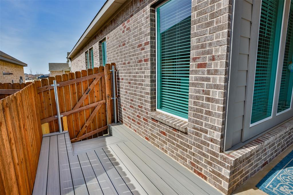 622 Juneau Street Gainesville, TX 76240 - Photo 7 of 39 a view of a house with wooden floor