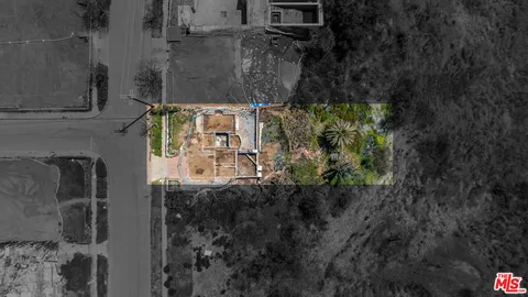 a aerial view of a house with a yard
