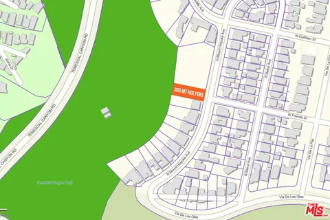 a living room with a bed and a window