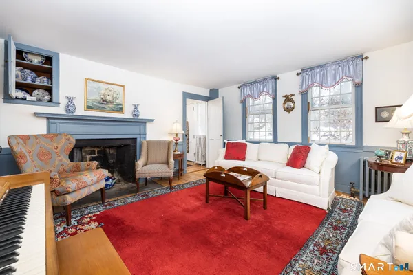 a living room with furniture and a fireplace
