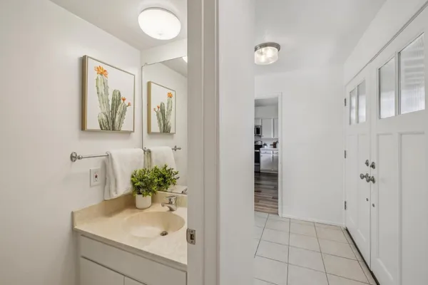 a utility room with sink dryer and washer