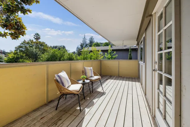 a chairs and table sitting in front of a house