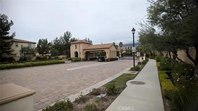 a view of city street with a building and trees in the background
