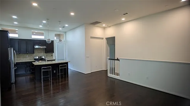 a kitchen with a table and chairs