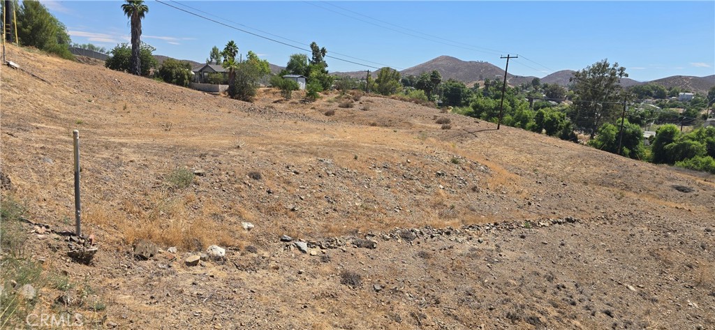 0 Nevada Drive Menifee, CA 92587 - Photo 3 of 4 a view of a dry yard with trees in the background