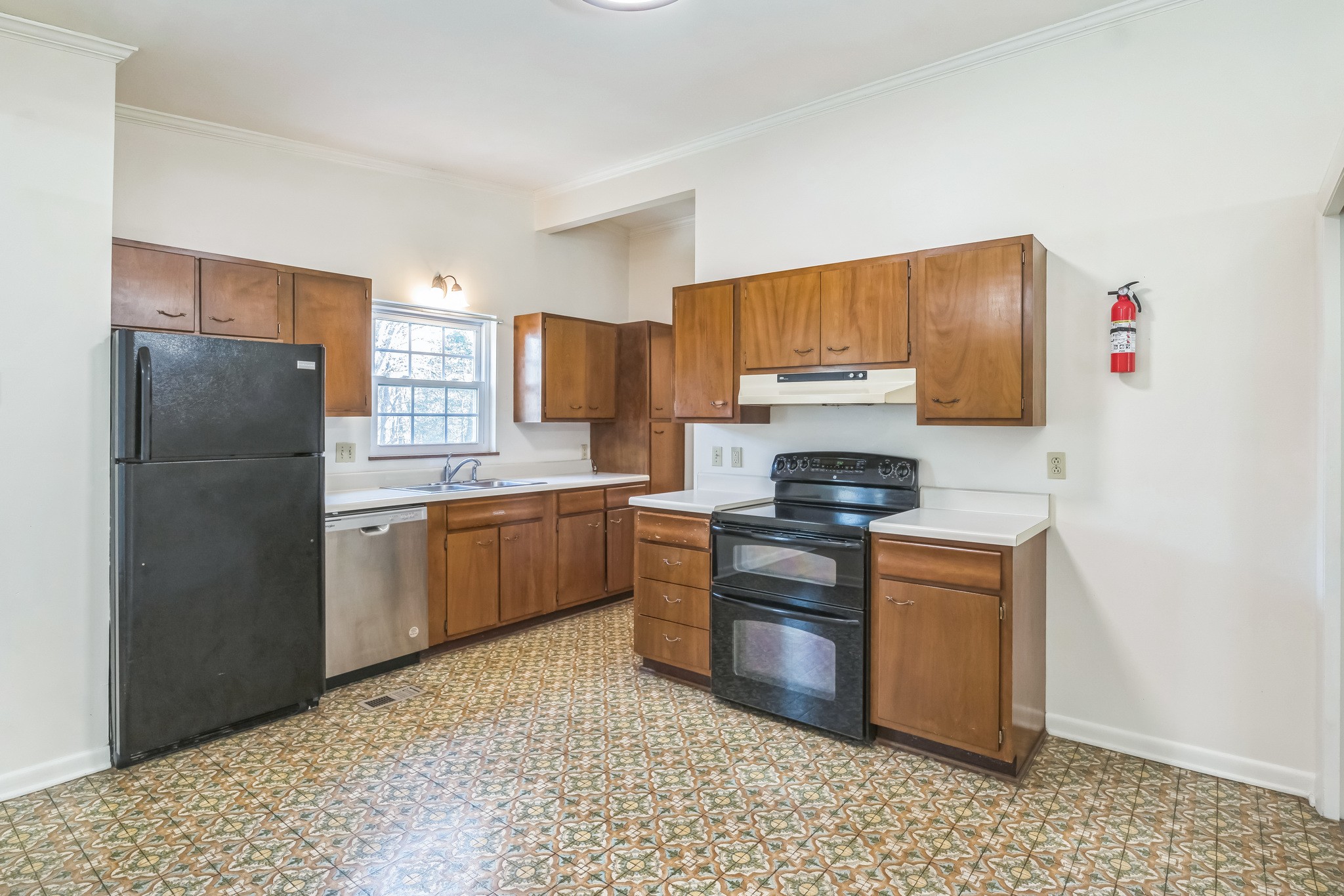 101 Locust Lane Oak Ridge, TN 37830 - Photo 15 of 33 a kitchen with a refrigerator sink and stove