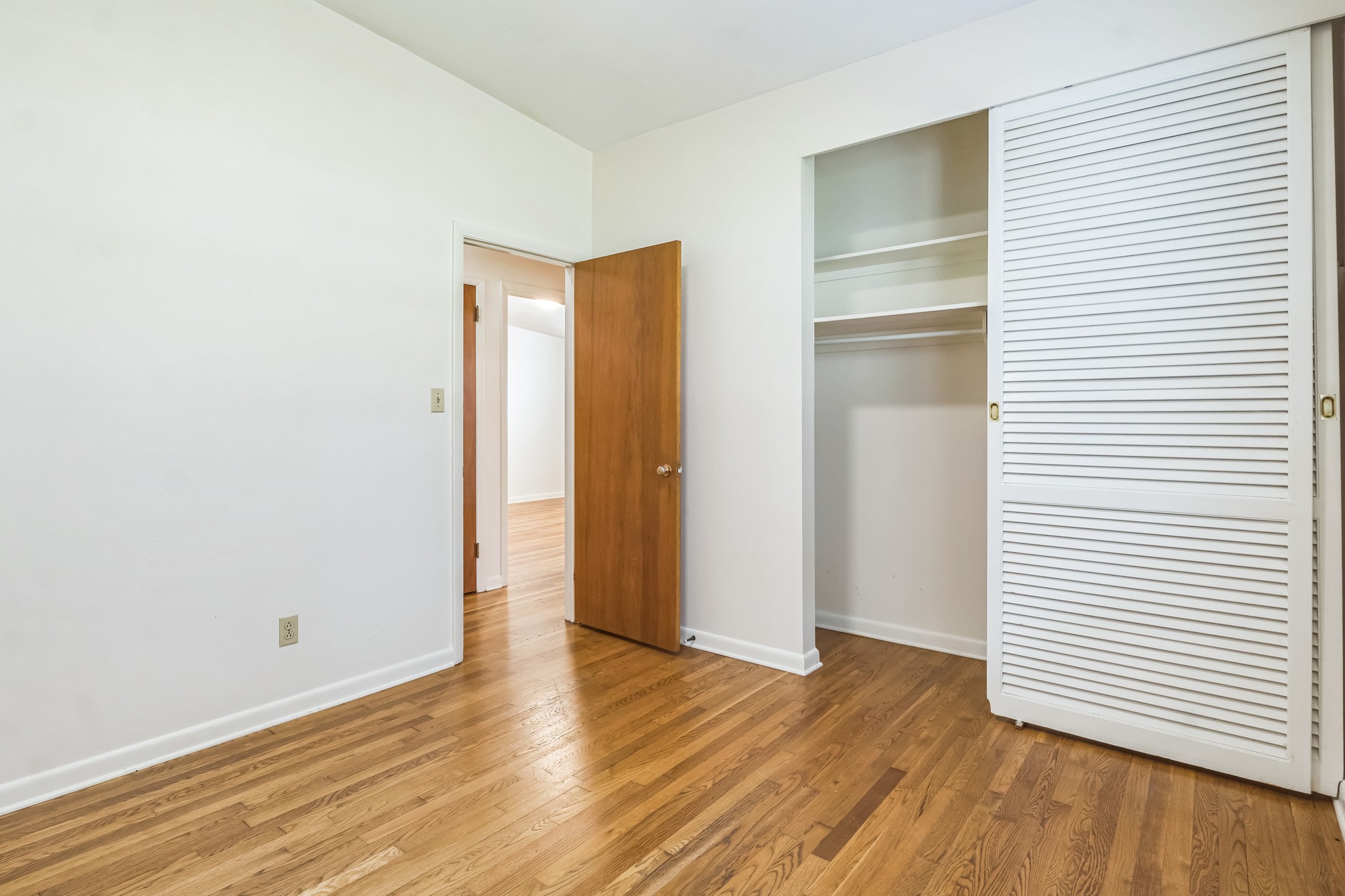 101 Locust Lane Oak Ridge, TN 37830 - Photo 5 of 33 a view of an empty room with wooden floor and a window