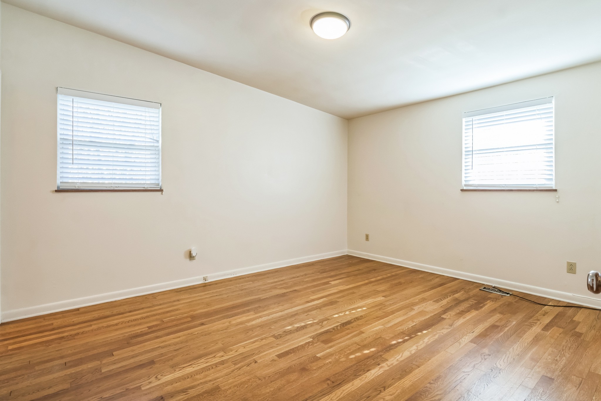 101 Locust Lane Oak Ridge, TN 37830 - Photo 8 of 33 an empty room with wooden floor and windows