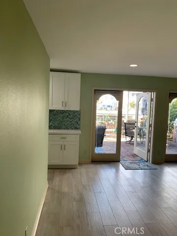 a view of a kitchen with a sink and a large window