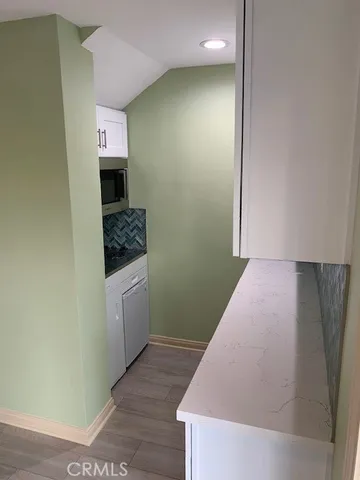 a hallway with washer and dryer