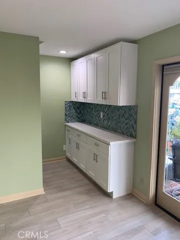 a room with cabinets and window