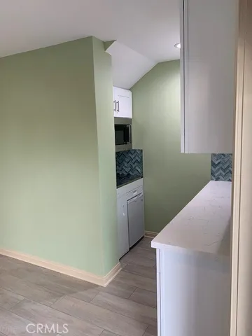 a hallway with washer and dryer