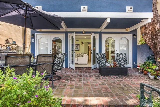 a view of a chairs and table in the patio