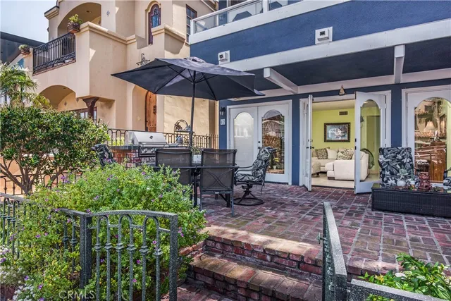 a view of a chair and table in backyard
