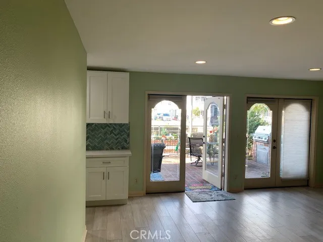 a living room with hardwood flooring and a fireplace