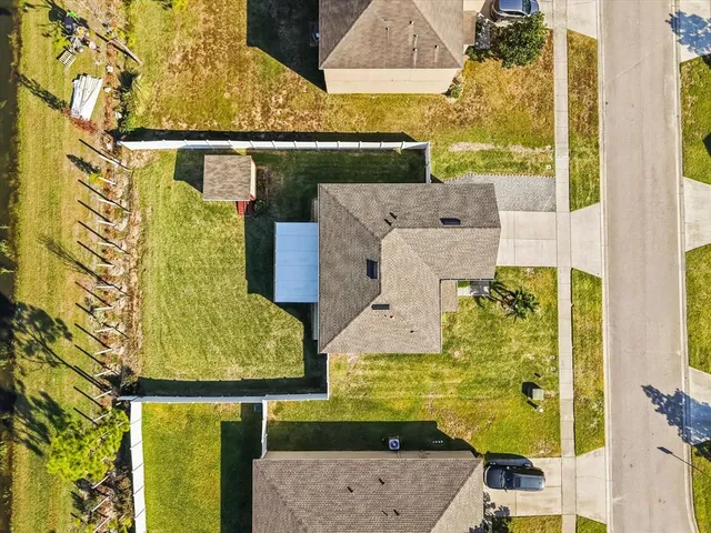an aerial view of residential houses with swimming pool