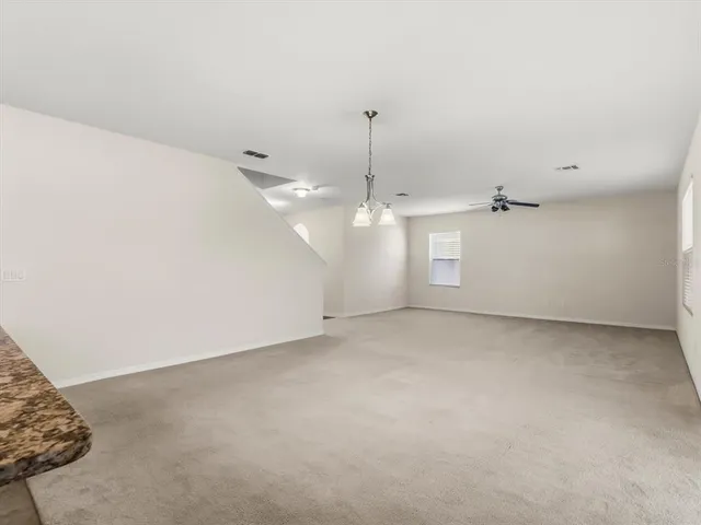 a view of a big room with closet and window