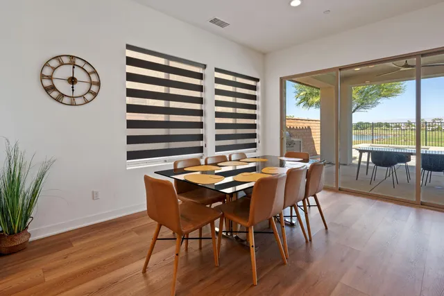 a large kitchen with kitchen island a large island in it