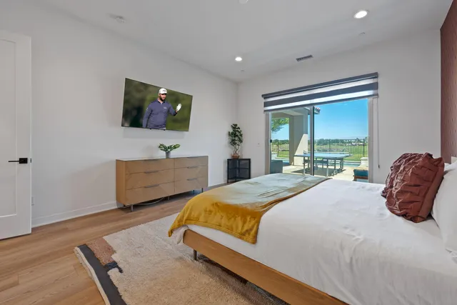 a bathroom with a double vanity sink toilet and a mirror