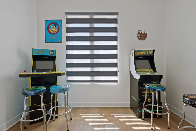 a view of a patio with a dining table and chairs