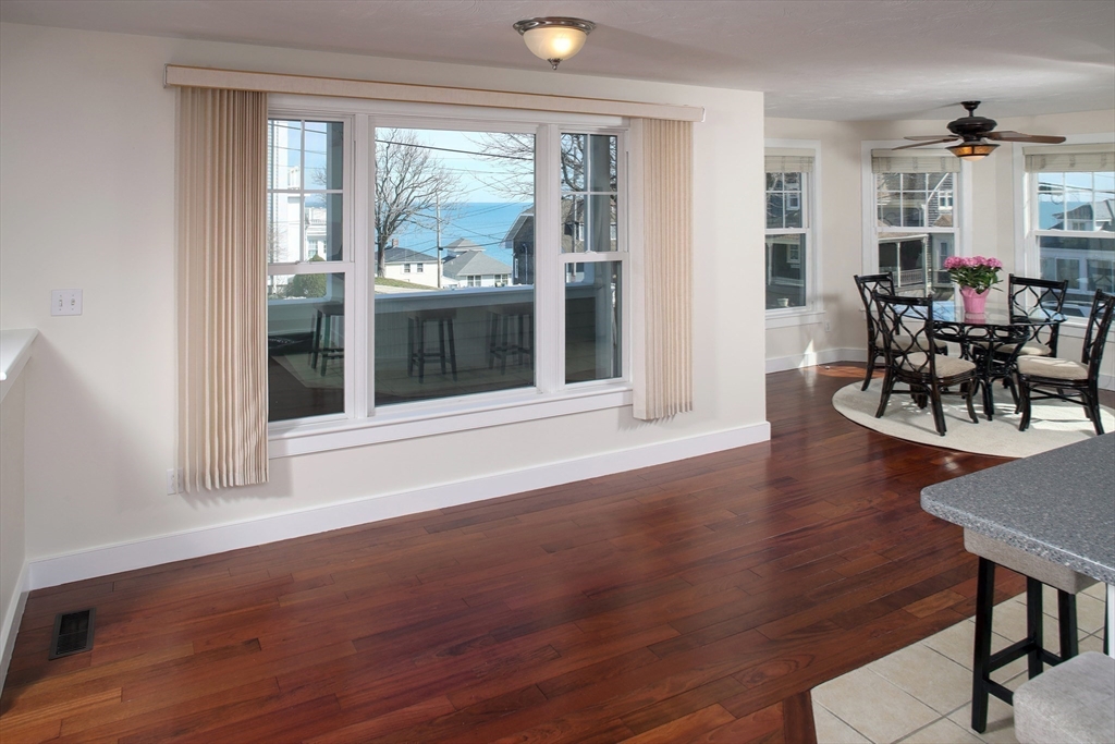 9 Meade Avenue, Unit 1 Hull, MA 02045 - Photo 12 of 34 a view of a livingroom with furniture and hardwood floor