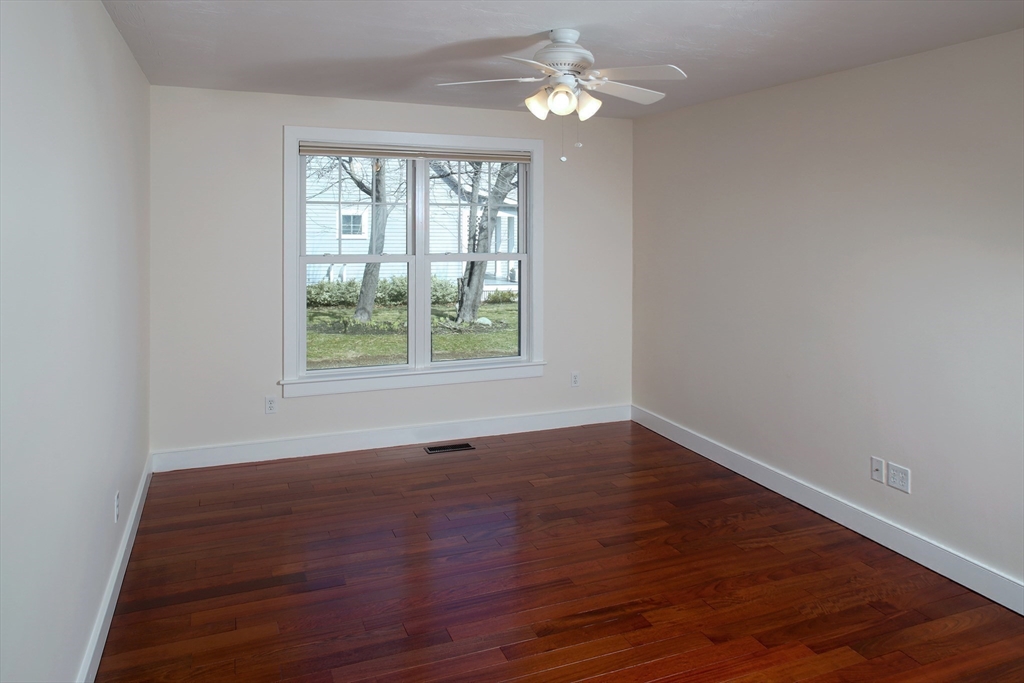 9 Meade Avenue, Unit 1 Hull, MA 02045 - Photo 15 of 34 wooden floor in an empty room with a window