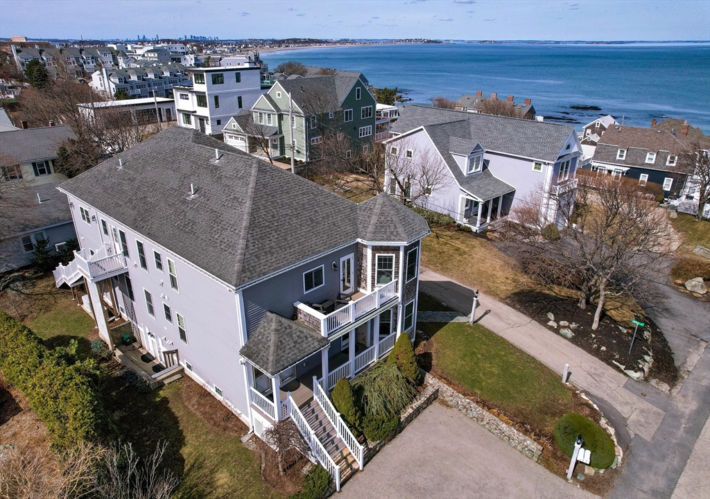 9 Meade Avenue, Unit 1 Hull, MA 02045 - Photo 2 of 34 an aerial view of residential houses with outdoor space