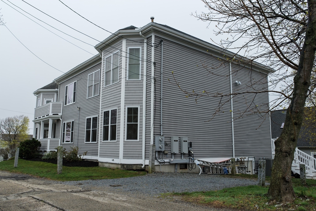 9 Meade Avenue, Unit 1 Hull, MA 02045 - Photo 29 of 34 a front view of a house with garden