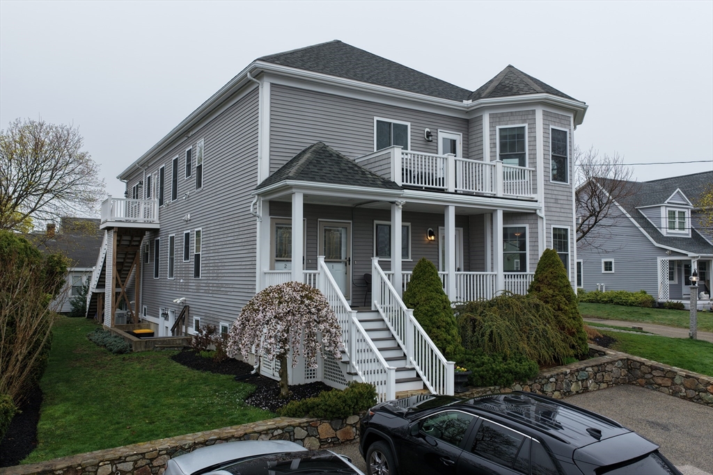9 Meade Avenue, Unit 1 Hull, MA 02045 - Photo 30 of 34 a front view of a house with a garden